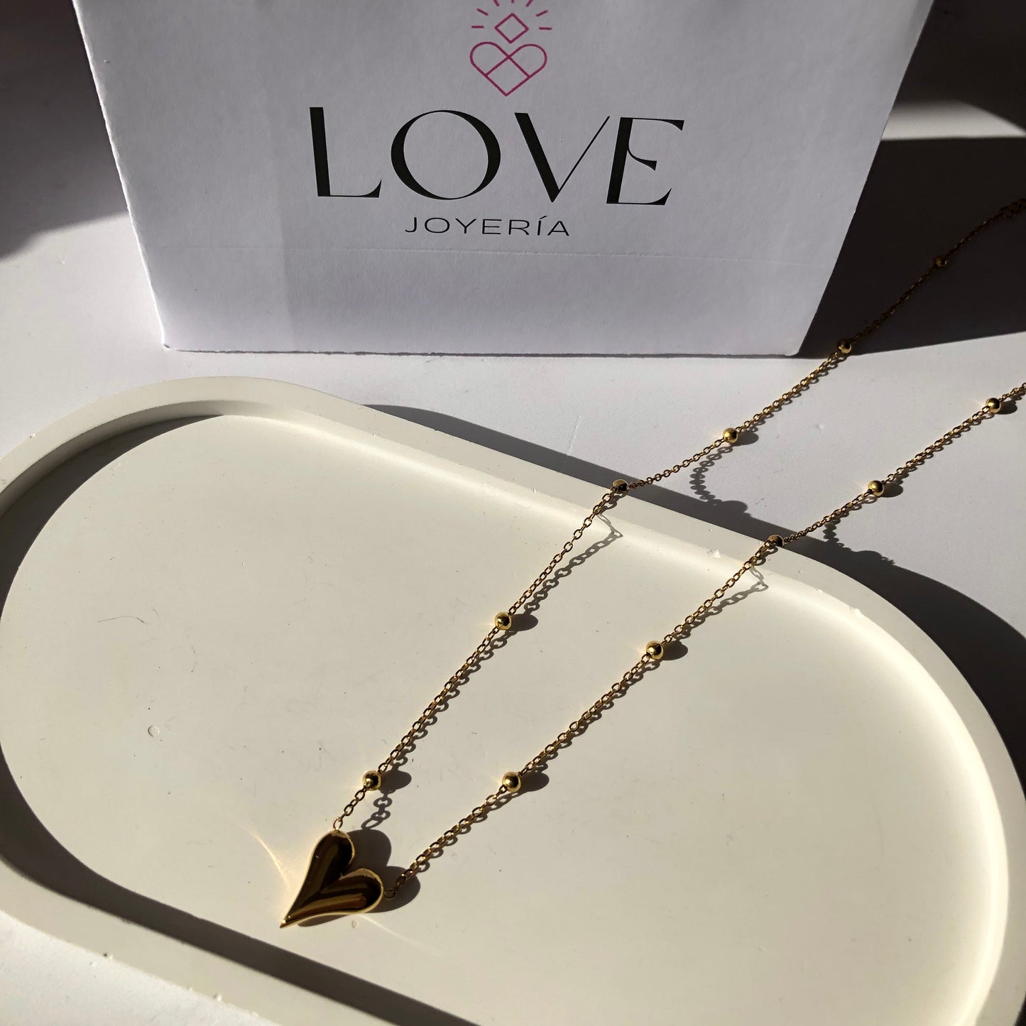 Cadena corazón dorada con bolitas