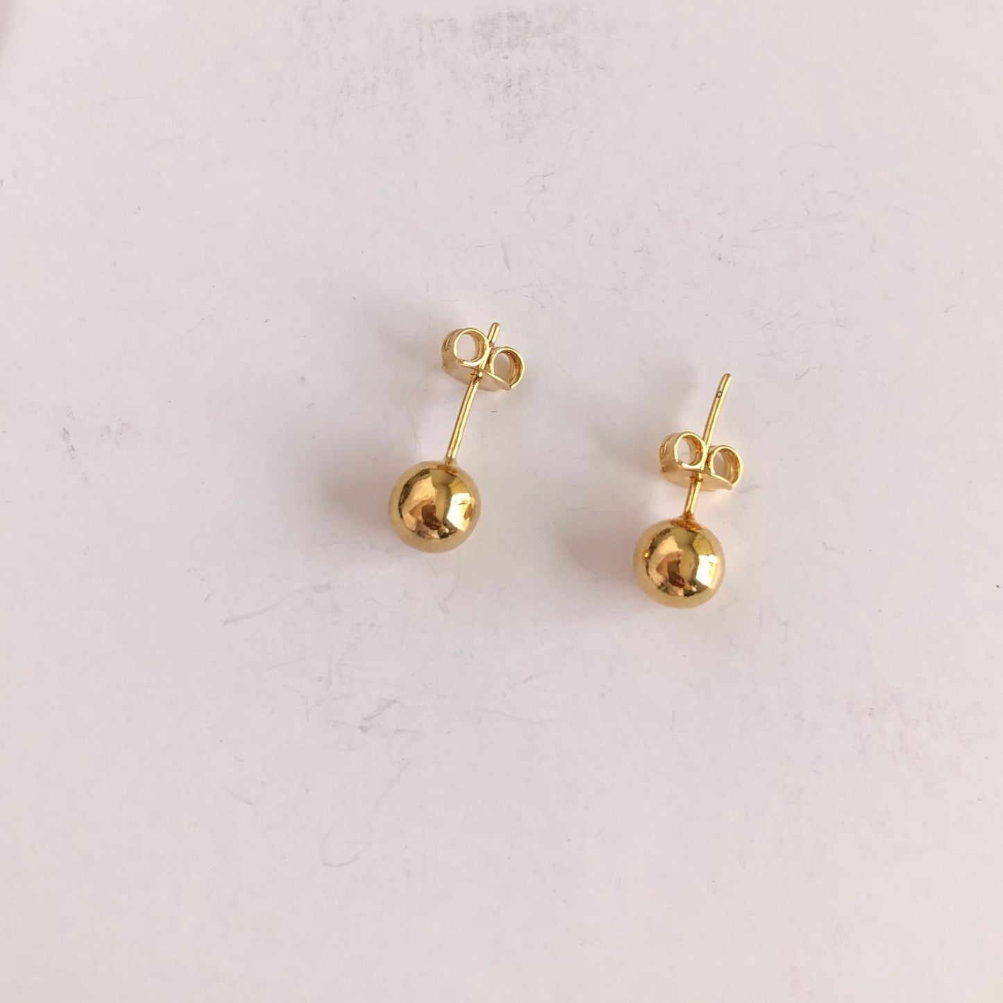 Aretes bolita