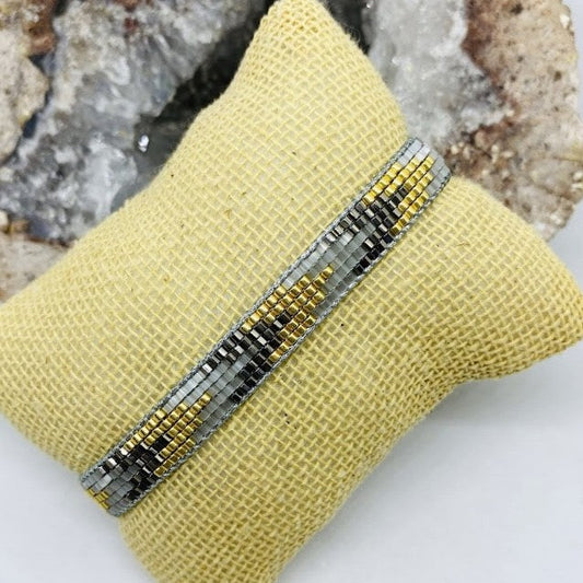 Pulsera Miyuki Gris, negra con dorado